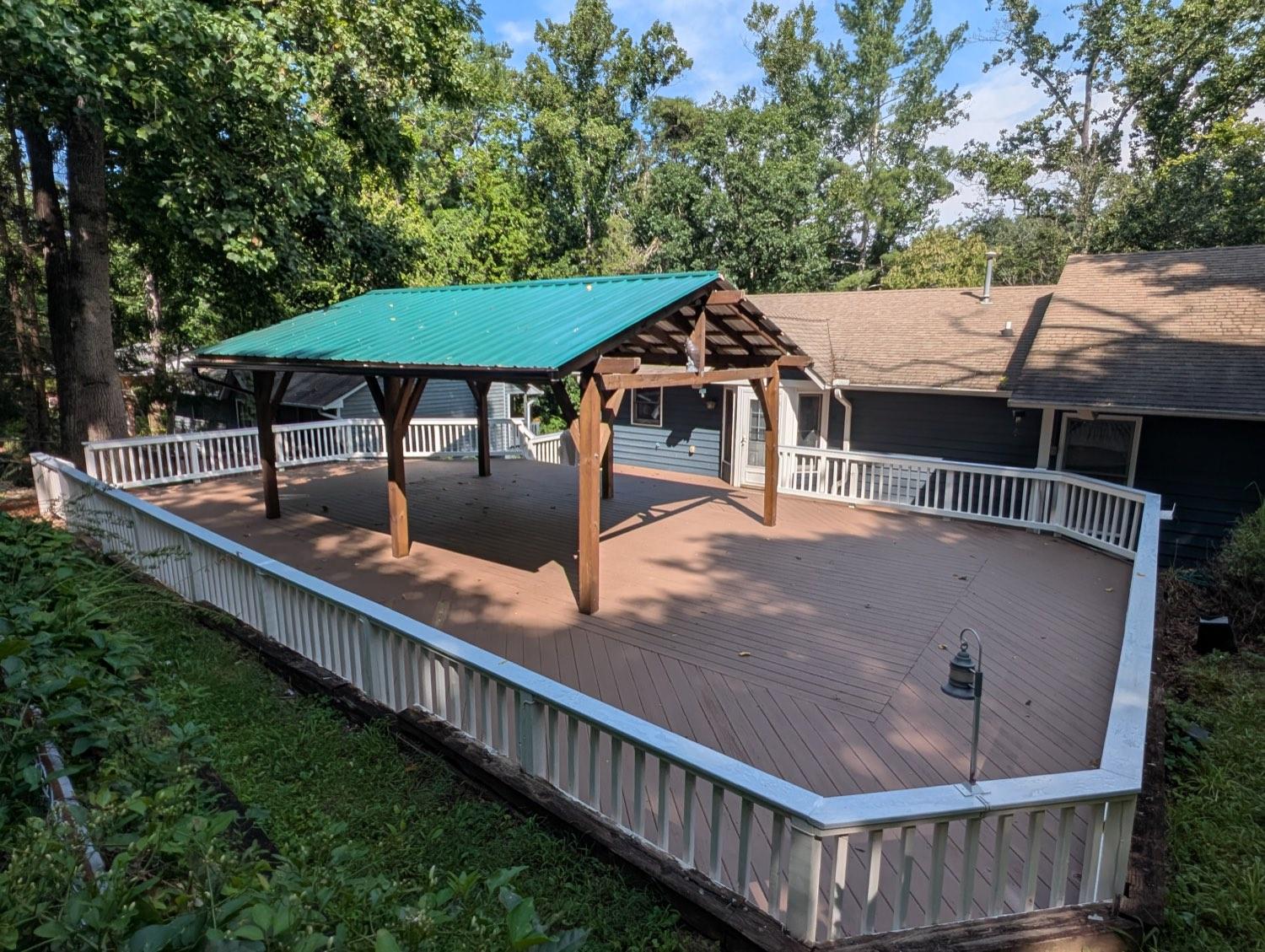 A resurfaced deck with fresh boards and a rebuilt pavilion overhead.